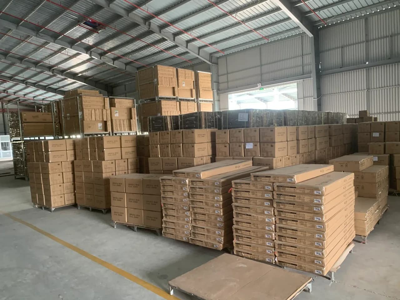 Finished products stacked in a Vietnamese factory warehouse