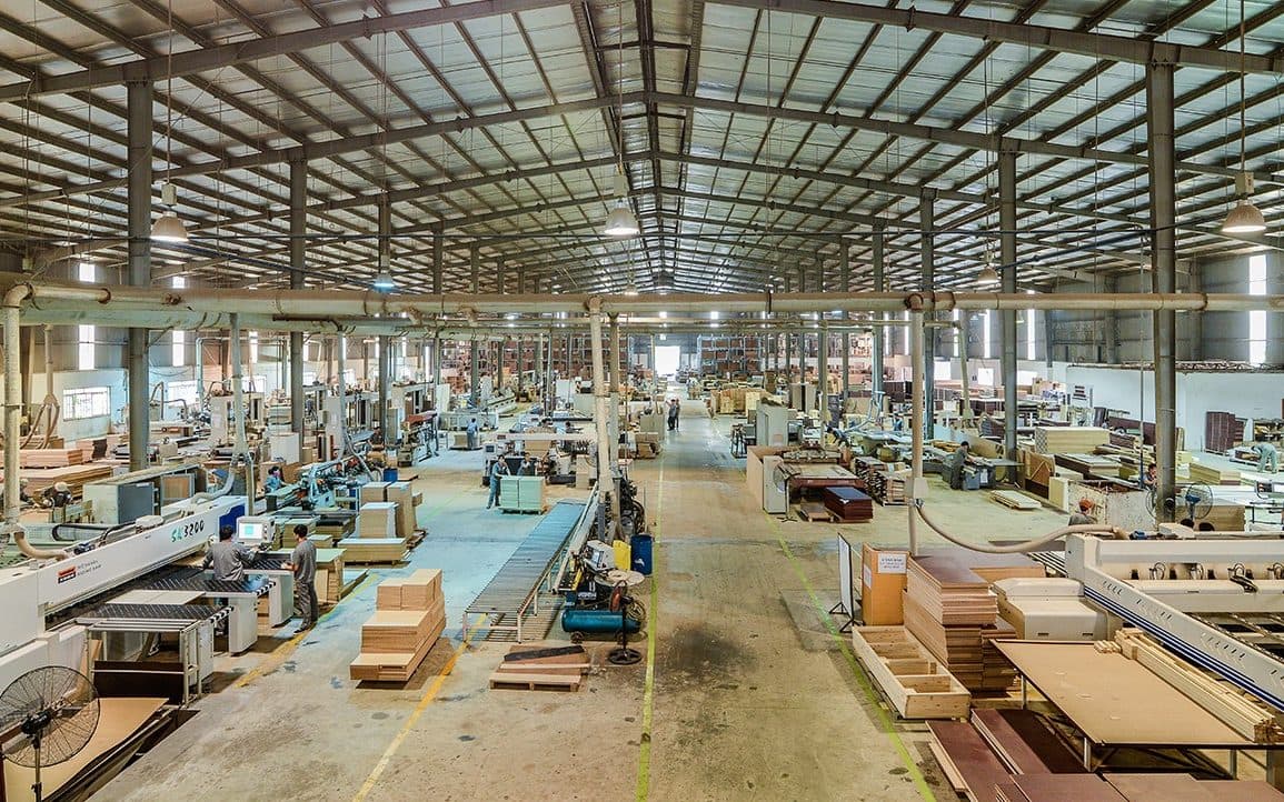 Vietnamese furniture factory floor with production machinery