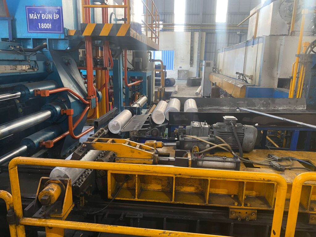 Aluminium extrusion press in operation